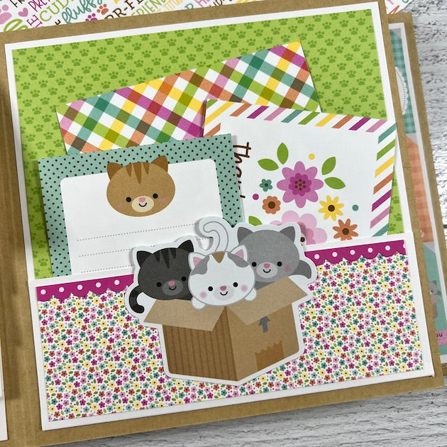 Kitty Cat Scrapbook Album page with cats in a box, flowers, and paw prints