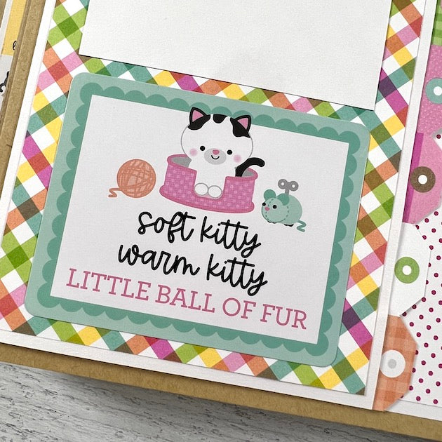 Kitty Cat Scrapbook Album page with yarn ball, cat, and rainbow plaid paper