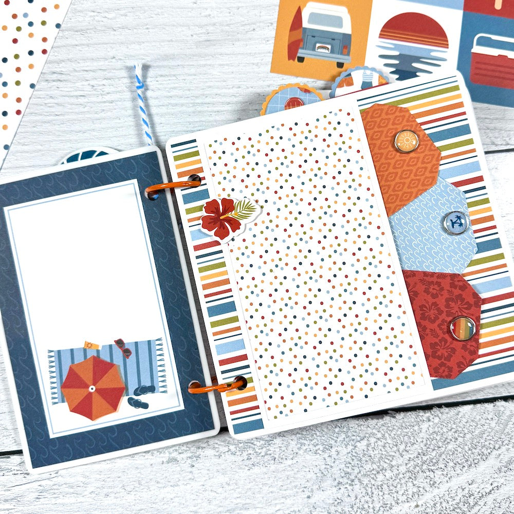 Chasing the Sun Summer Scrapbook Album Page with an umbrella, beach towel, waves, and a pocket with tags