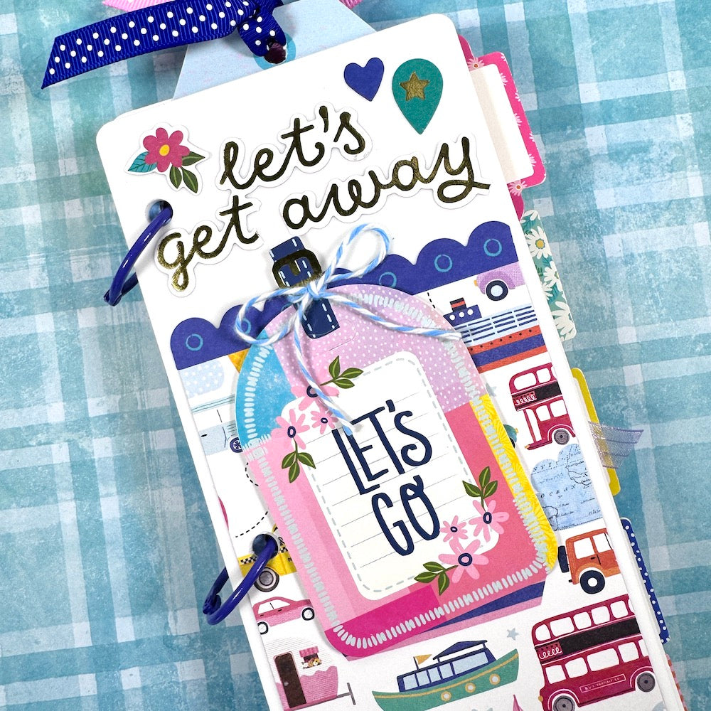 Let's Get Away Travel Mini Album with flowers, tags, boats, cars, and airplanes