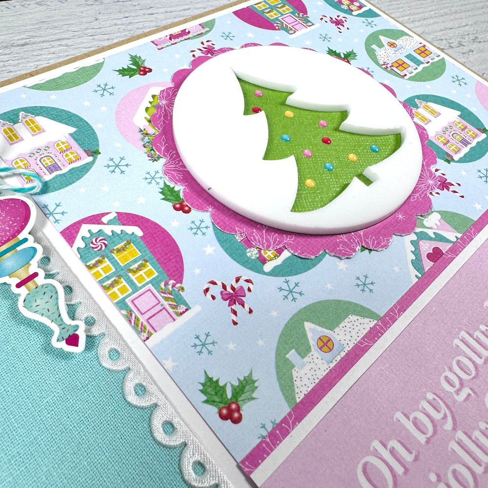 Christmas Scrapbook Mini Album with a tree, snow covered houses, holly berries, and snowflakes
