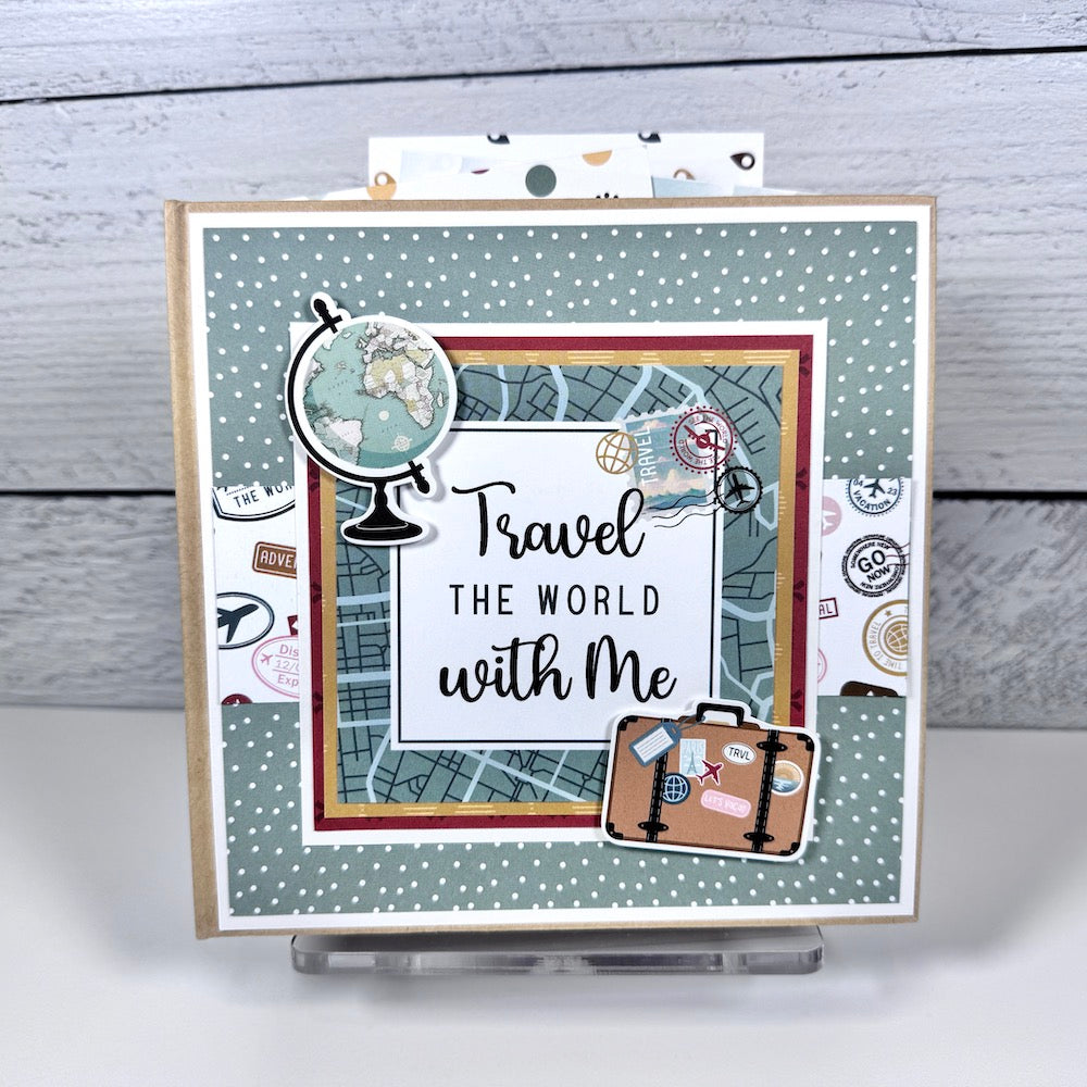 Travel The World With Me Scrapbook Album with map, globe, suitcase, and travel stamps