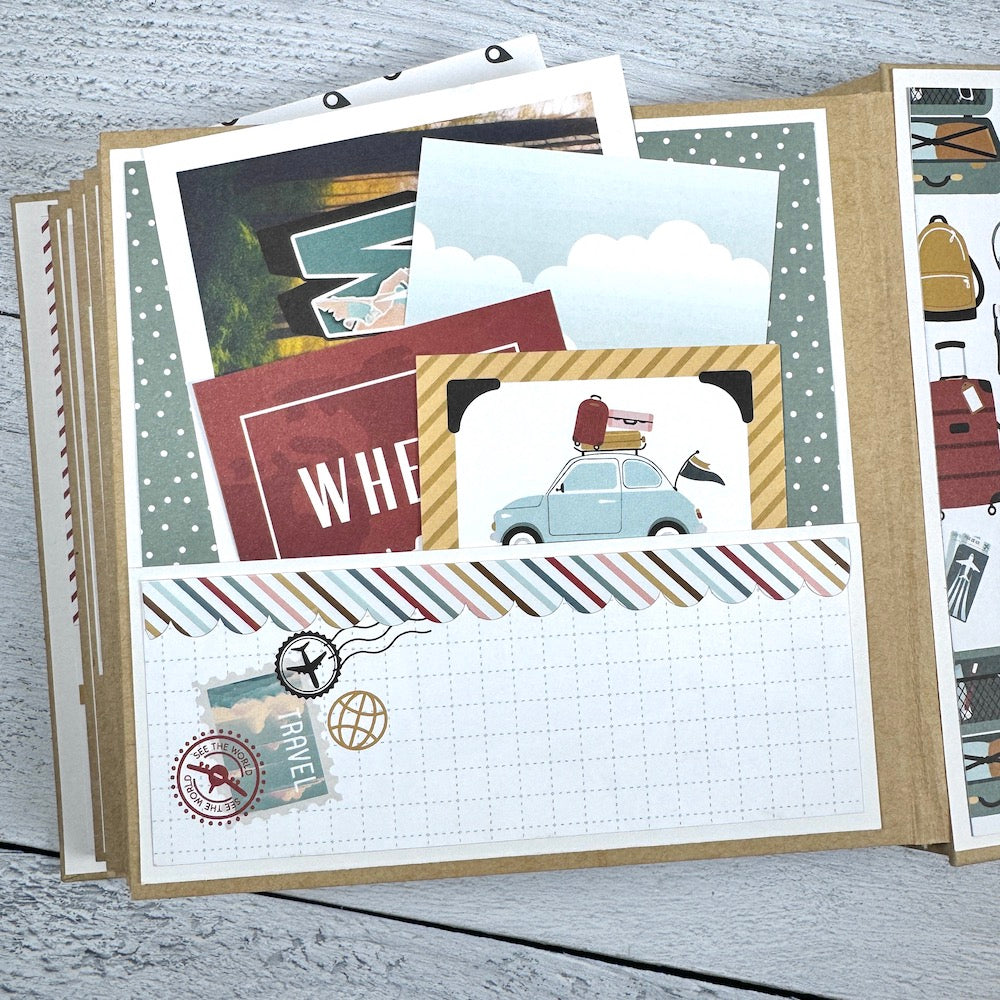 Travel The World With Me Scrapbook Album page with a pocket, journaling cards, and travel stamps