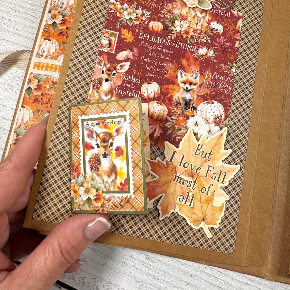 Autumn Greetings Scrapbook Album page with a deer, a fox, fall leaves, and pumpkins