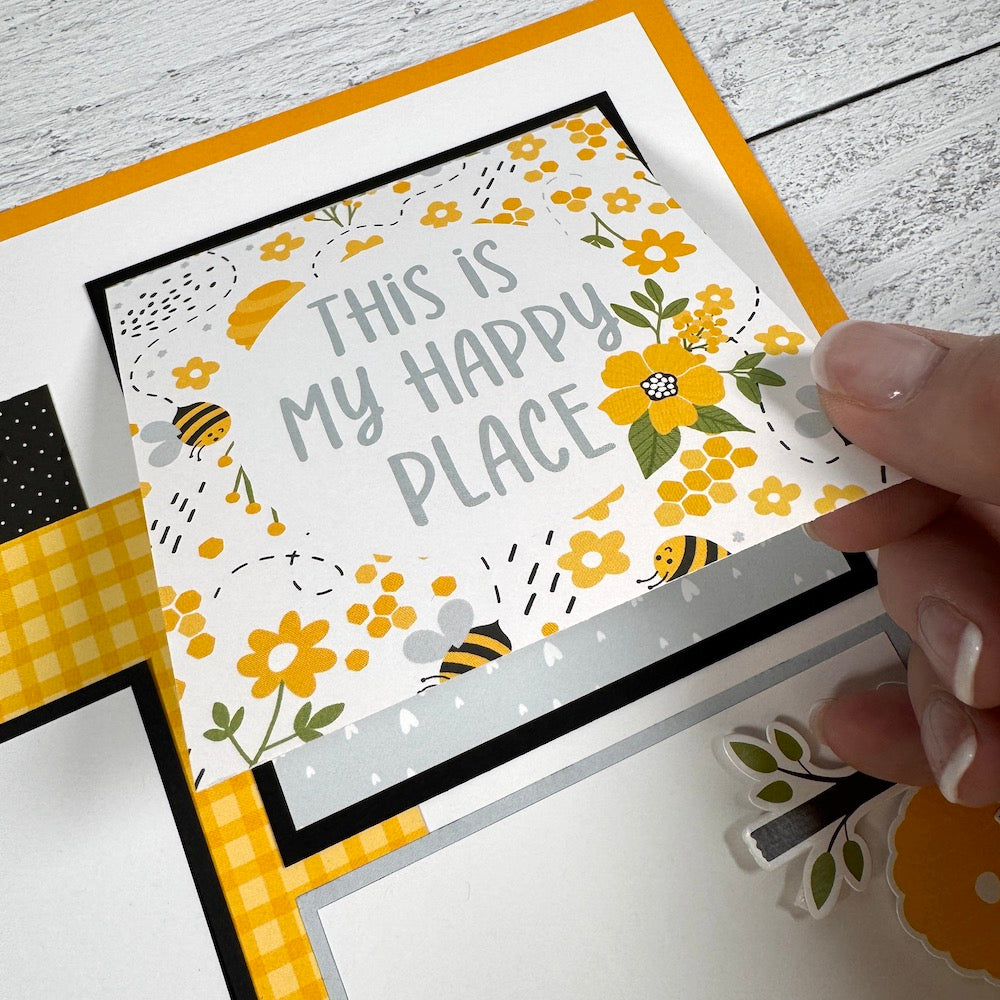 12x12 Bee Happy Scrapbook Page Layout with flowers, bees, beehives, and a folding card