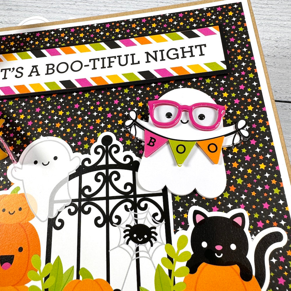 Halloween Scrapbook Album with ghosts, pumpkins, a cat, spider, and stars