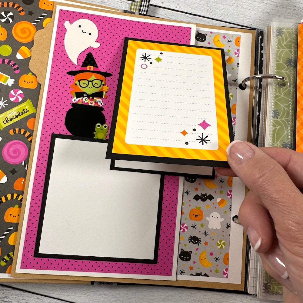 Halloween Scrapbook Album Page with a ghost, a witch, colorful candy, a journaling card, and a folding page