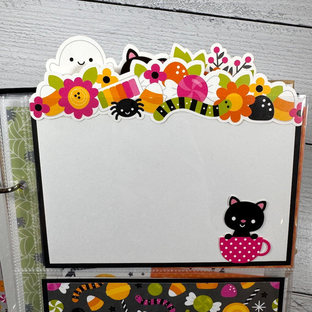 Halloween Scrapbook Album Page with flowers, colorful candy, a ghost, and a cute black cat