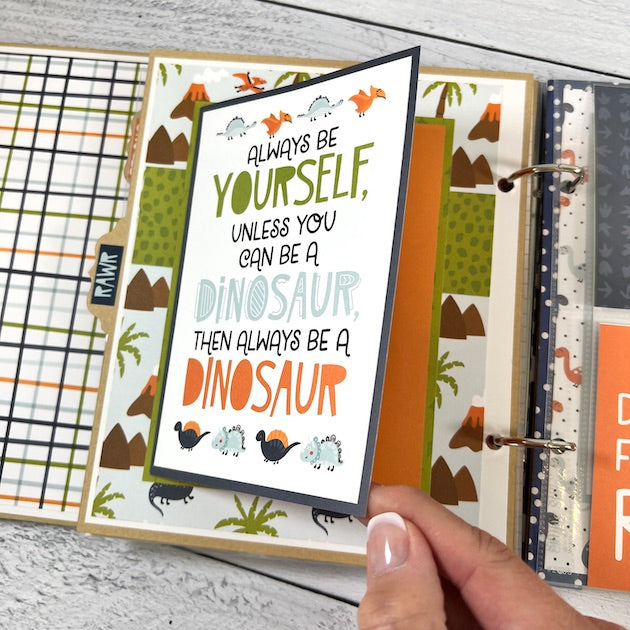 Be Fierce Dinosaur Scrapbook Album page with dinosaurs, volcanos, and trees