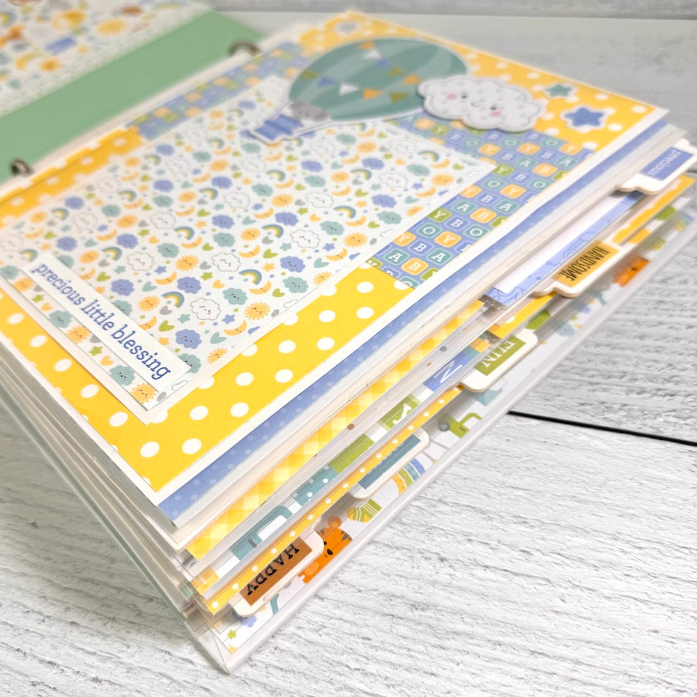 My Baby Boy Scrapbook Album with lots of colorful pages, tabs, stars, polka dots, rainbows, and interactive elements