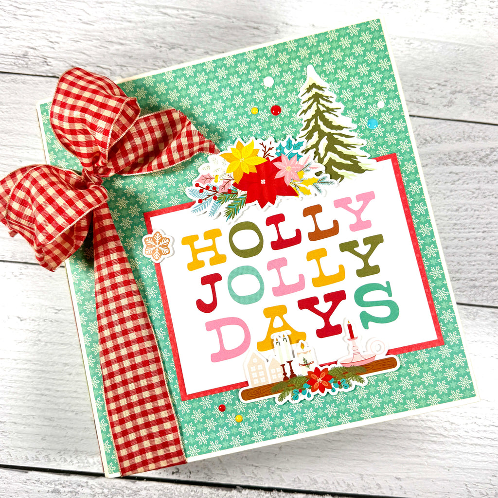 Holly Jolly Days Christmas Scrapbook Album with pine trees, poinsettia flowers, and snowflakes