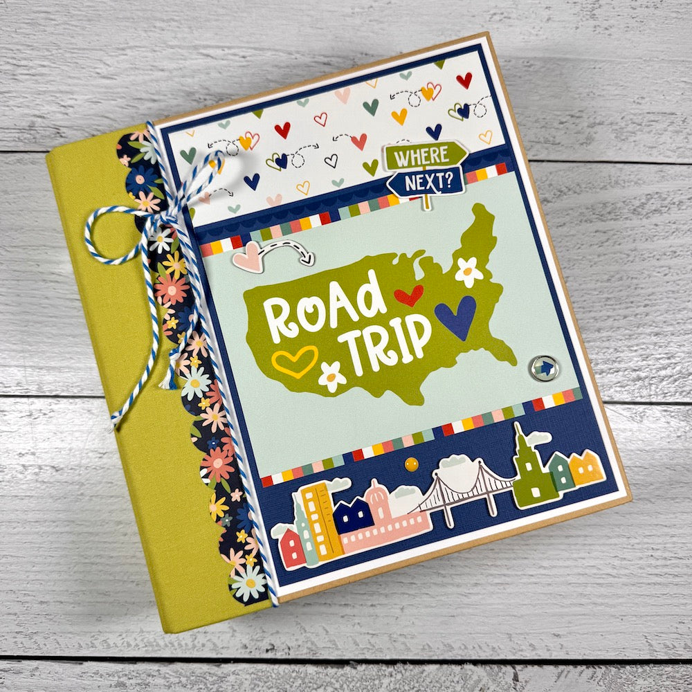 Road Trip Travel Scrapbook Mini Album with a map, flowers, colorful hearts, twine, and enamel brads