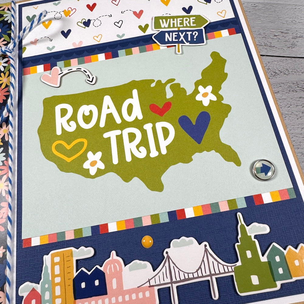 Road Trip Travel Scrapbook Mini Album with a map, flowers, colorful hearts, twine, and enamel brads