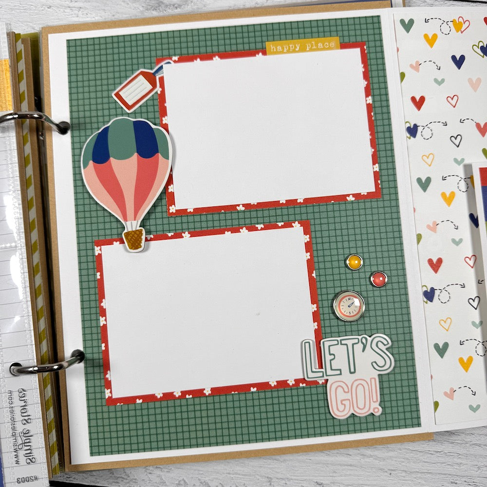 Road Trip Travel Scrapbook Album page with a hot air balloon, enamel brads, hearts, a photo mats