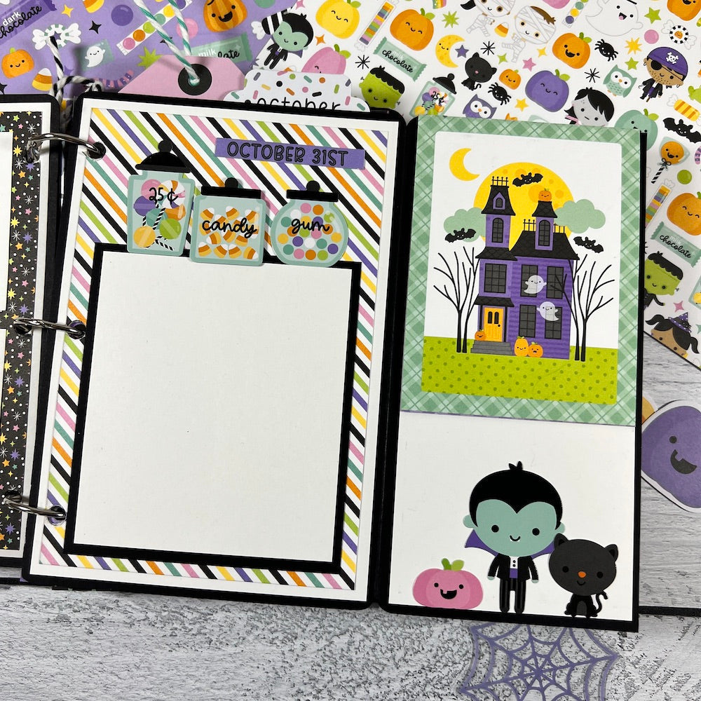 Halloween Scrapbook Album Page with candy, a pumpkin, & a haunted house
