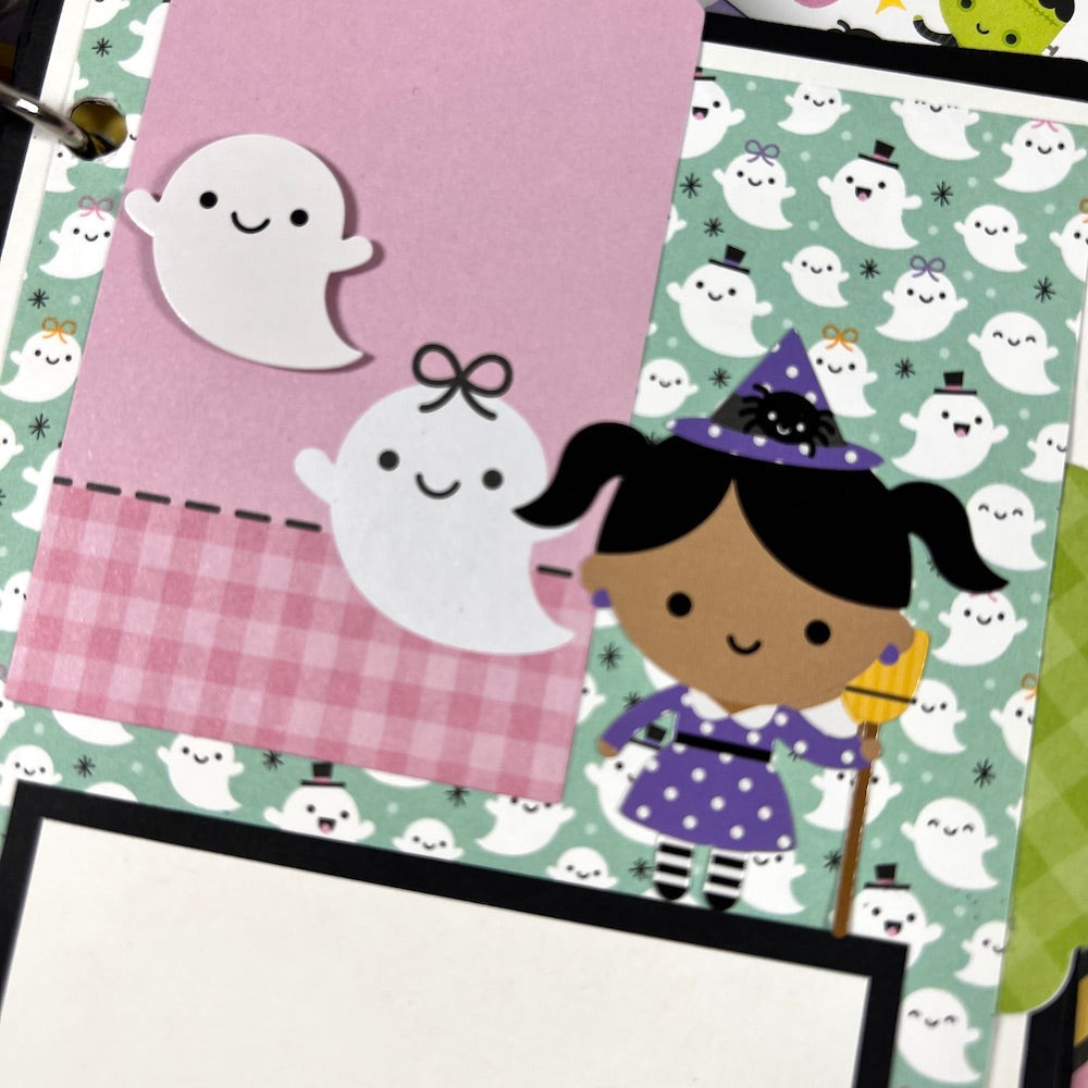 Halloween Scrapbook Album Page with lots of ghosts and a cute little witch