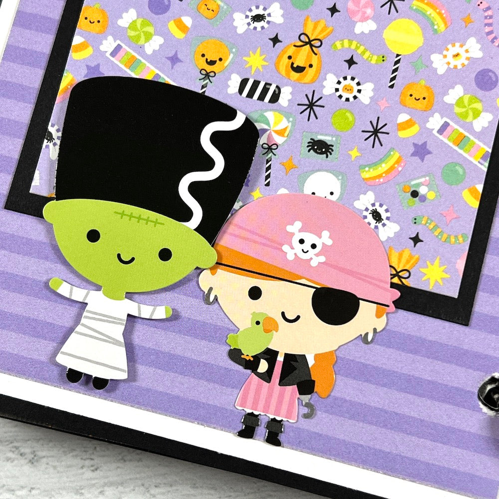 Halloween Scrapbook Album Page with candy, stickers, and trick or treaters in costumes