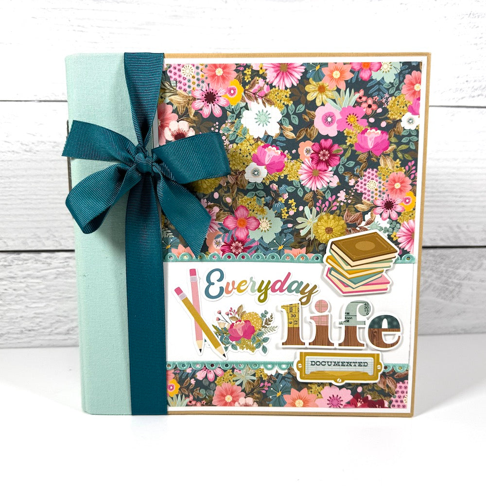 Everyday Life Scrapbook Album Kit with gorgeous flowers, scalloped ribbon, books, and a big bow