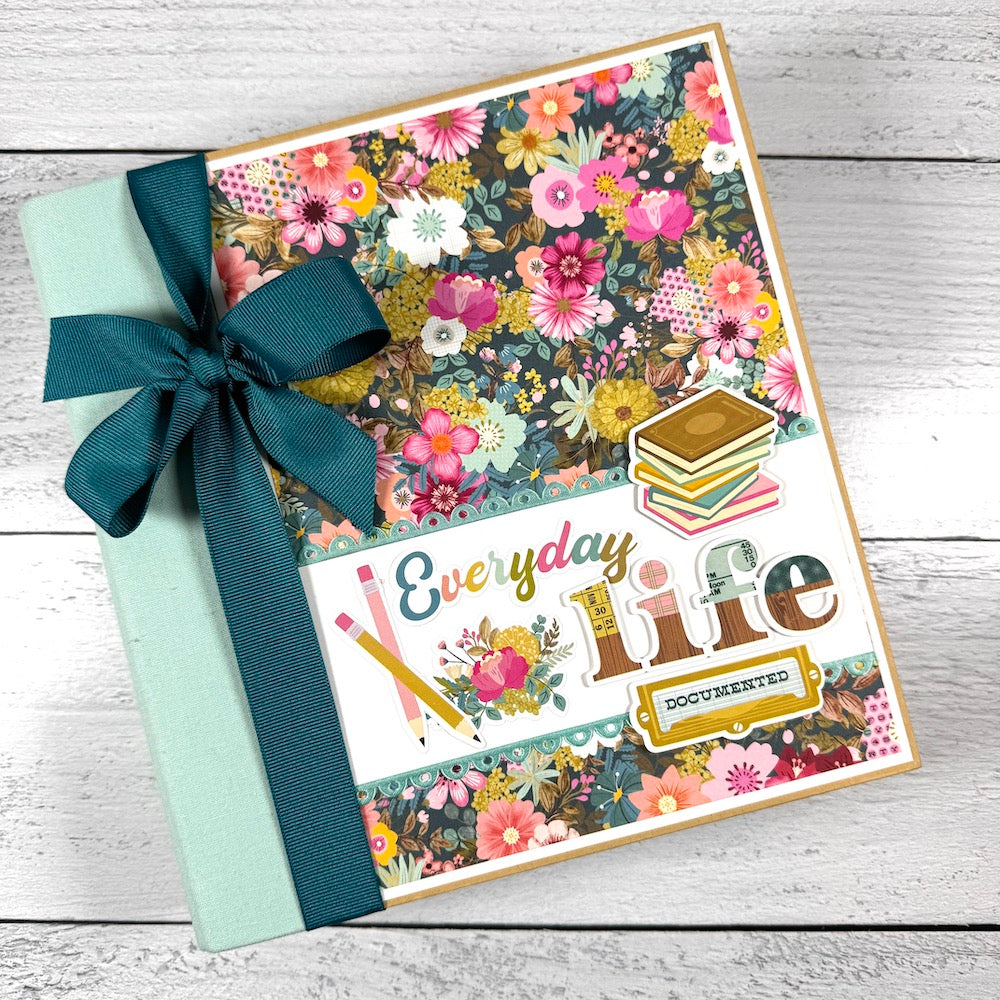 Everyday Life Scrapbook Album Kit with gorgeous flowers, scalloped ribbon, books, and a big bow