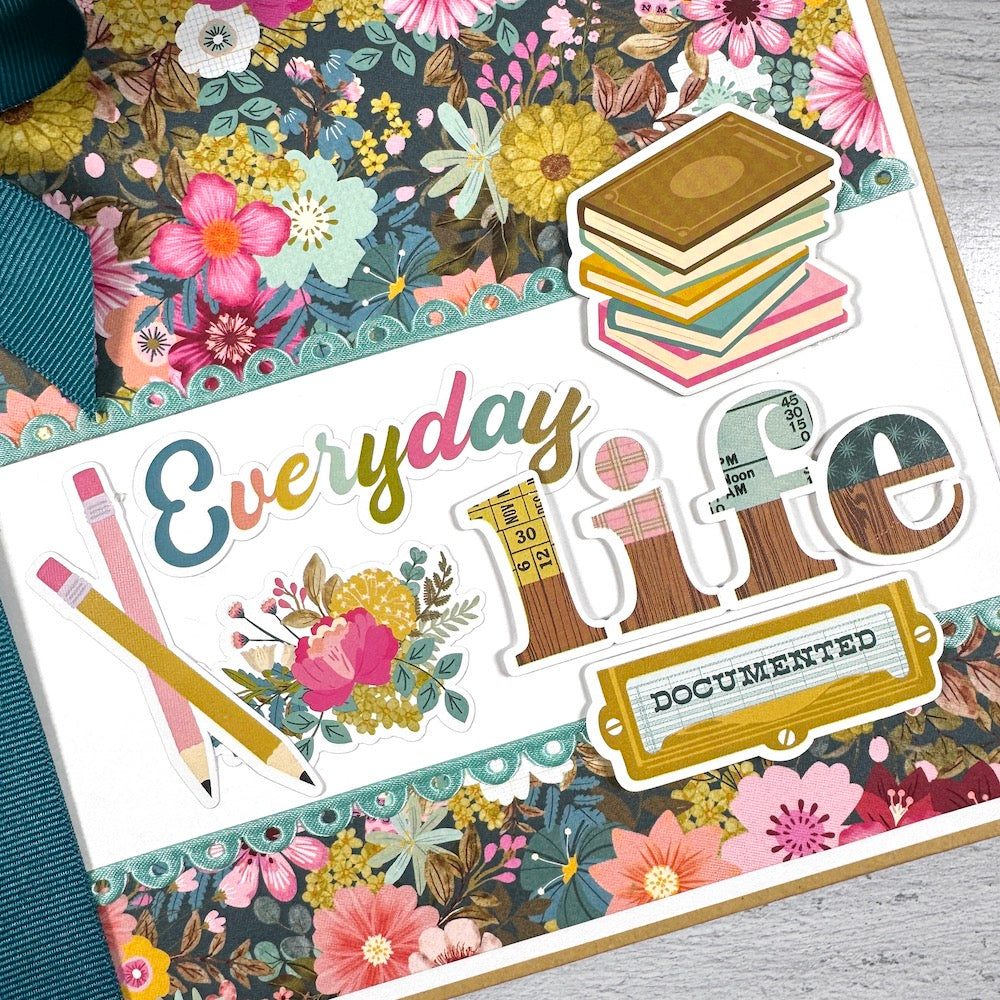 Everyday Life Scrapbook Album Kit with gorgeous flowers, scalloped ribbon, books, and a big bow