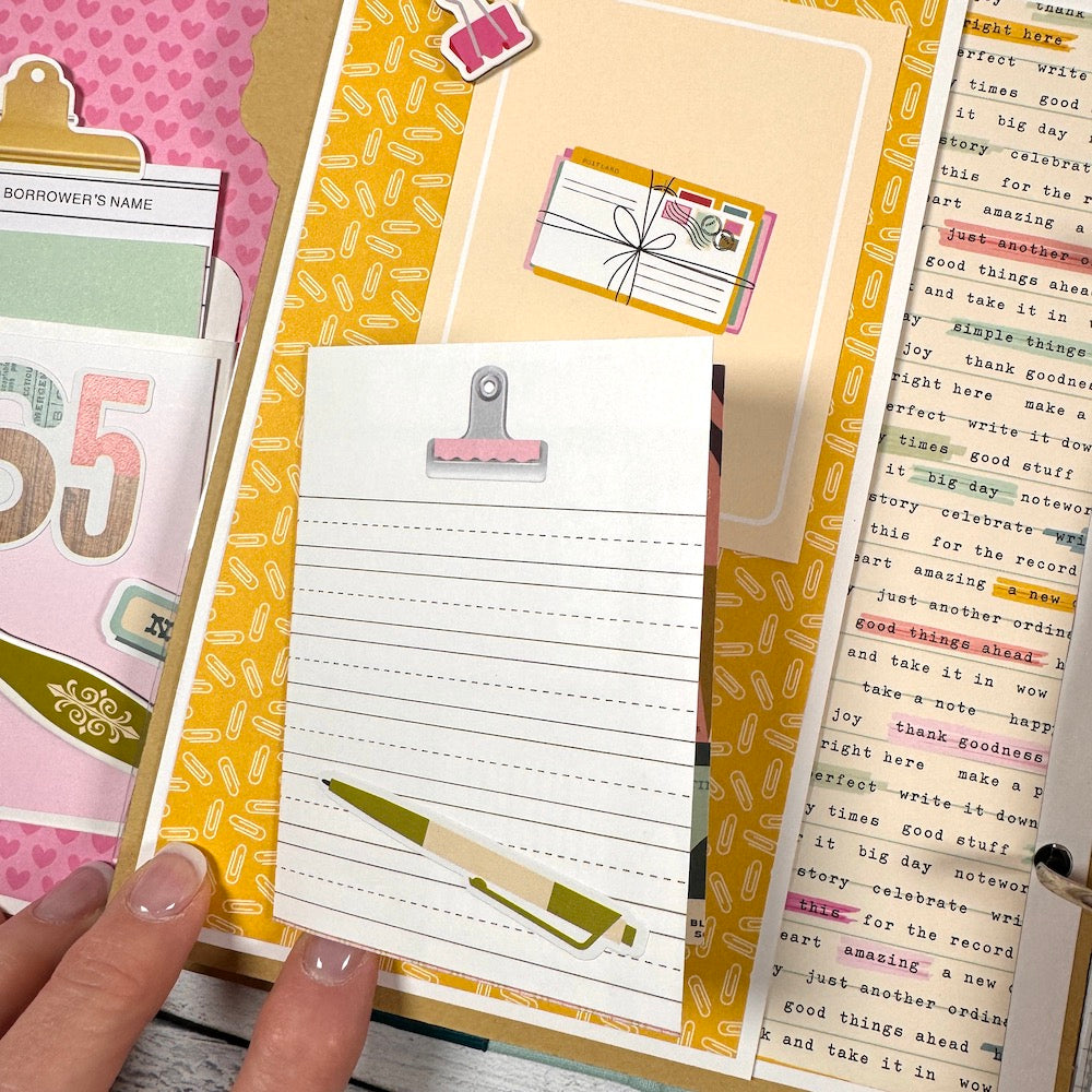 Everyday Life Scrapbook Album Page with a folding card, paperclips, and mail