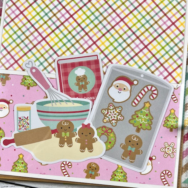 Christmas scrapbook album page with gingerbread cookies, a recipe book, and baking utensils