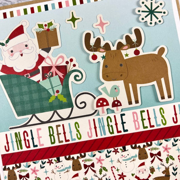 Christmas Scrapbook Album with Santa, a moose, and wrapped presents 