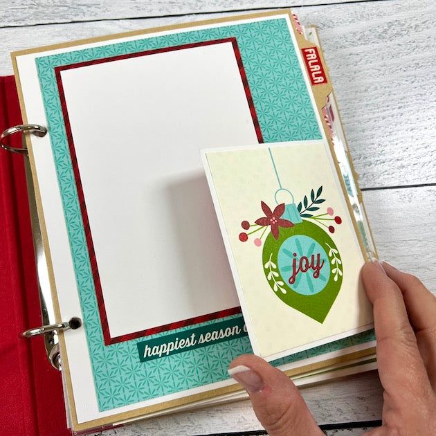 Christmas Scrapbook Album Page with an ornament, flowers, and berries