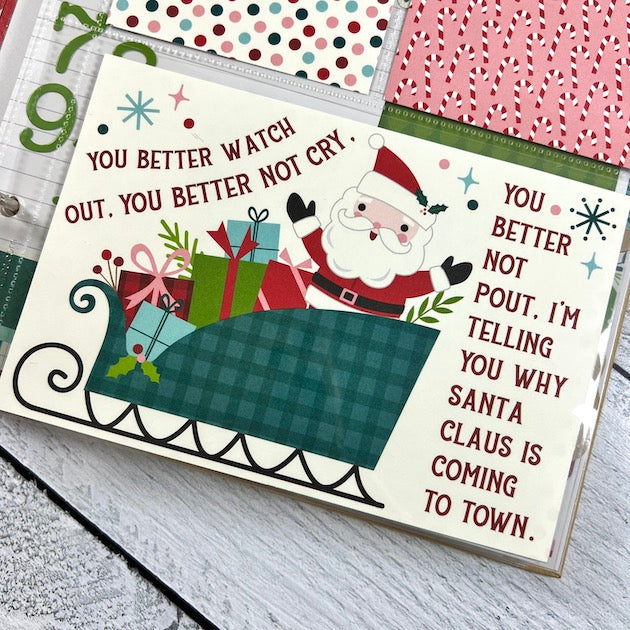 Christmas Scrapbook Album Page with Santa, a sleigh, and presents