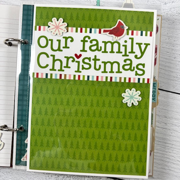 Christmas Scrapbook Album Page with a red bird, trees, and snowflakes