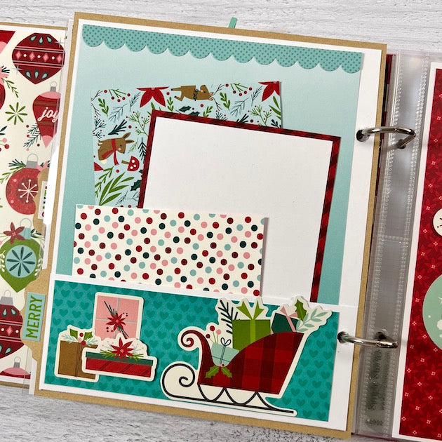 Christmas Scrapbook Album Page with a pocket, sleigh, and presents
