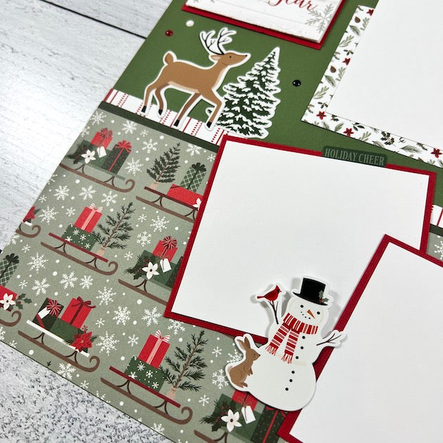 Christmas 12x12 Scrapbook Page with a reindeer, snowman, sleds, presents, and snowflakes