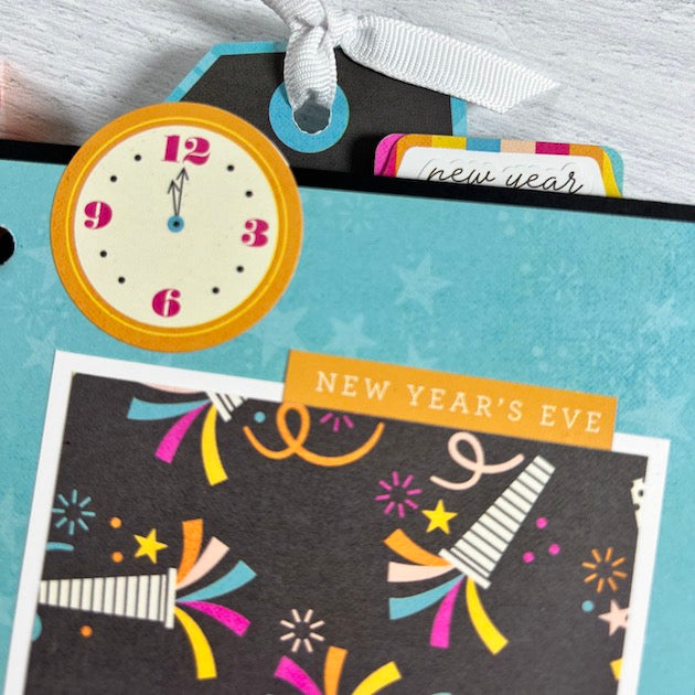 Happy New Year Scrapbook Album page with a clock, fireworks, stars, and party horns