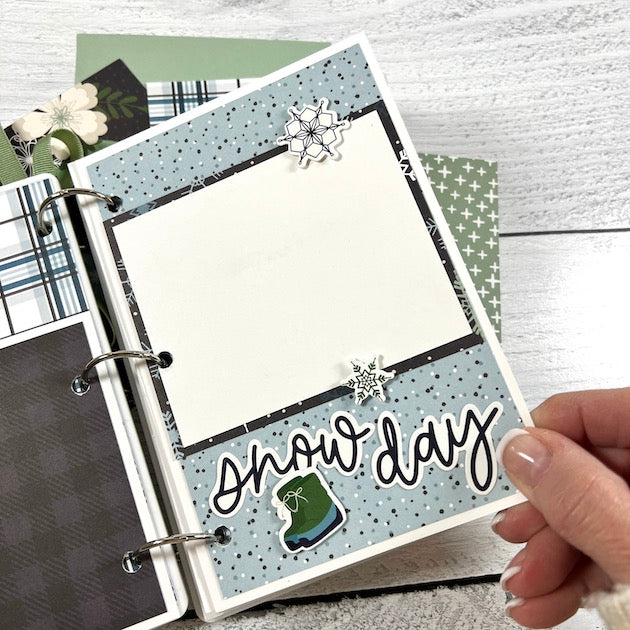 Winter Scrapbook Album Page with snowflakes, boots, a plaid print, and polka dots