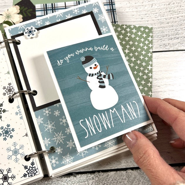 Winter Scrapbook Album Page with snowflakes, a snowman, and a folding card