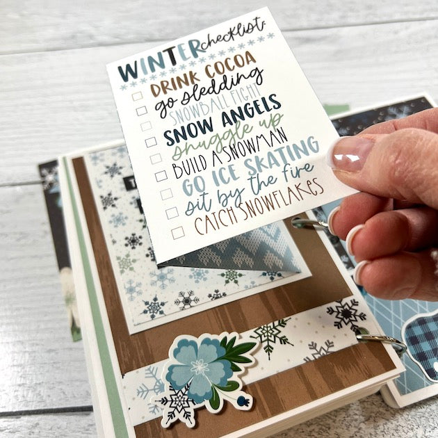 Winter Scrapbook Album Page with flowers, snowflakes, and a folding card