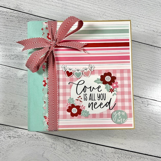 Love Valentine scrapbook album with hearts and flowers