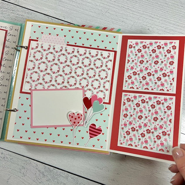 Love Valentine scrapbook album page with flowers, hearts, balloons, and a fold-out page