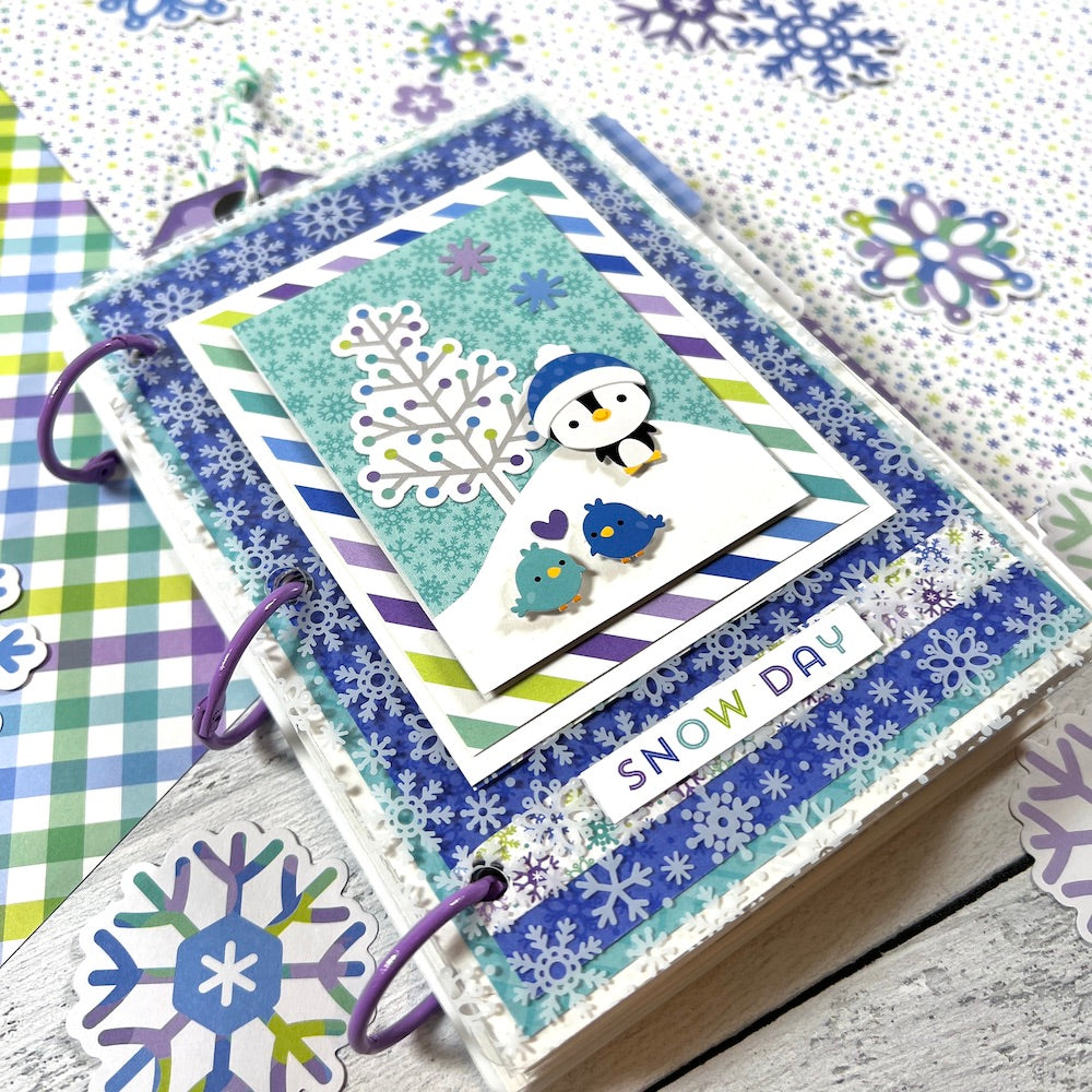 Snow Day Winter Scrapbook Mini Album with snowflakes, a cute penguin, and 2 little birds
