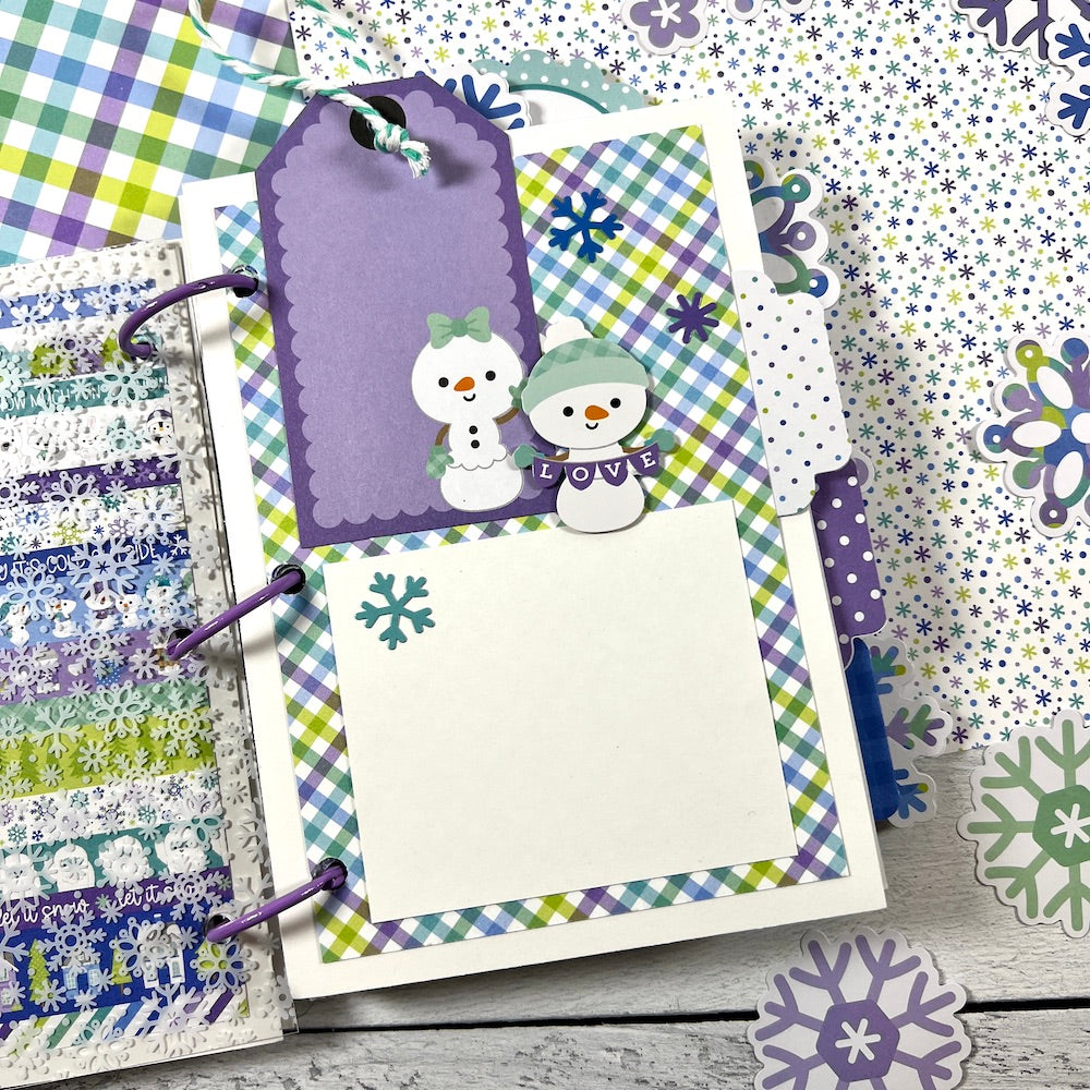 Snow Day Winter Scrapbook Mini Album page with 2 cute snowman, colorful plaid paper, a purple tag, and twine