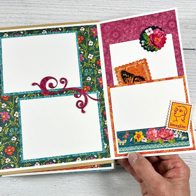 Let's Get Artsy Scrapbook Album folding page with vibrant colors, beautiful flowers, and a pocket