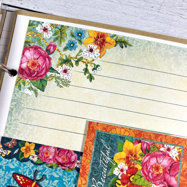 Let's Get Artsy scrapbook album page with vibrant colors, flowers, and a journaling spot