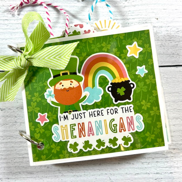 Spring St Patrick's Day Scrapbook Album with a rainbow, pot of gold, leprechaun, & shamrocks