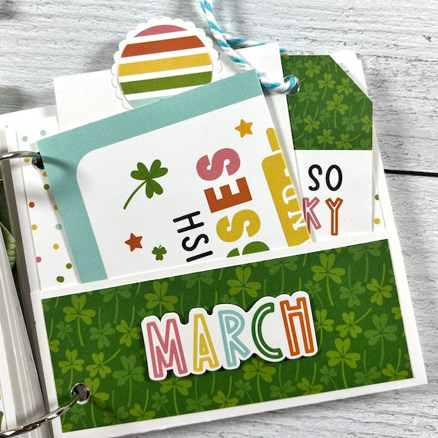 Spring St. Patrick's Day Scrapbook Album page with a pocket, shamrocks, and journaling cards