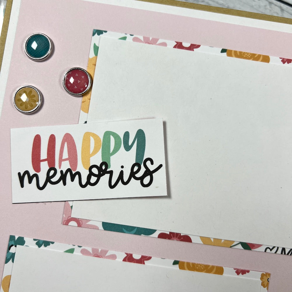 Our Life scrapbook album page with pretty flowers, sentiment, and shiny brads