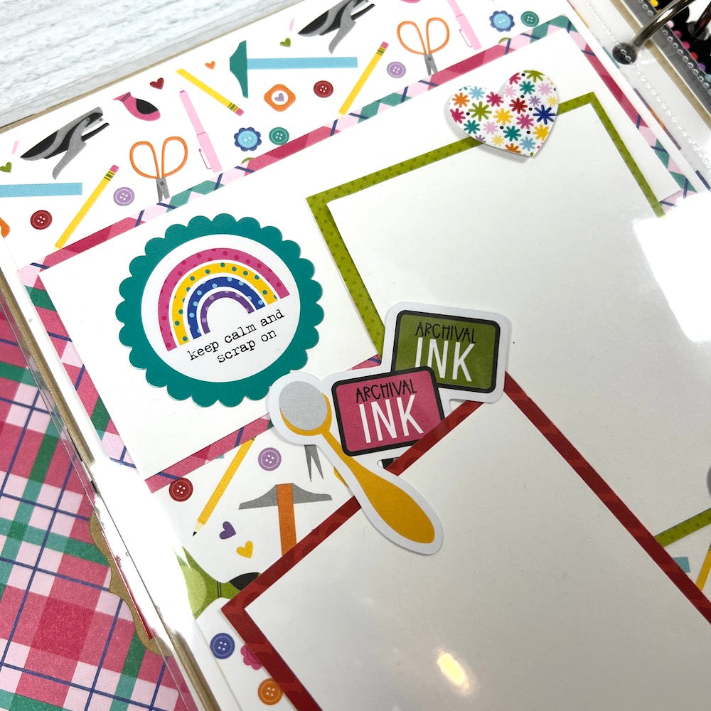 Crafty Friends scrapbook album page with colorful crafting supplies, a rainbow, and a heart