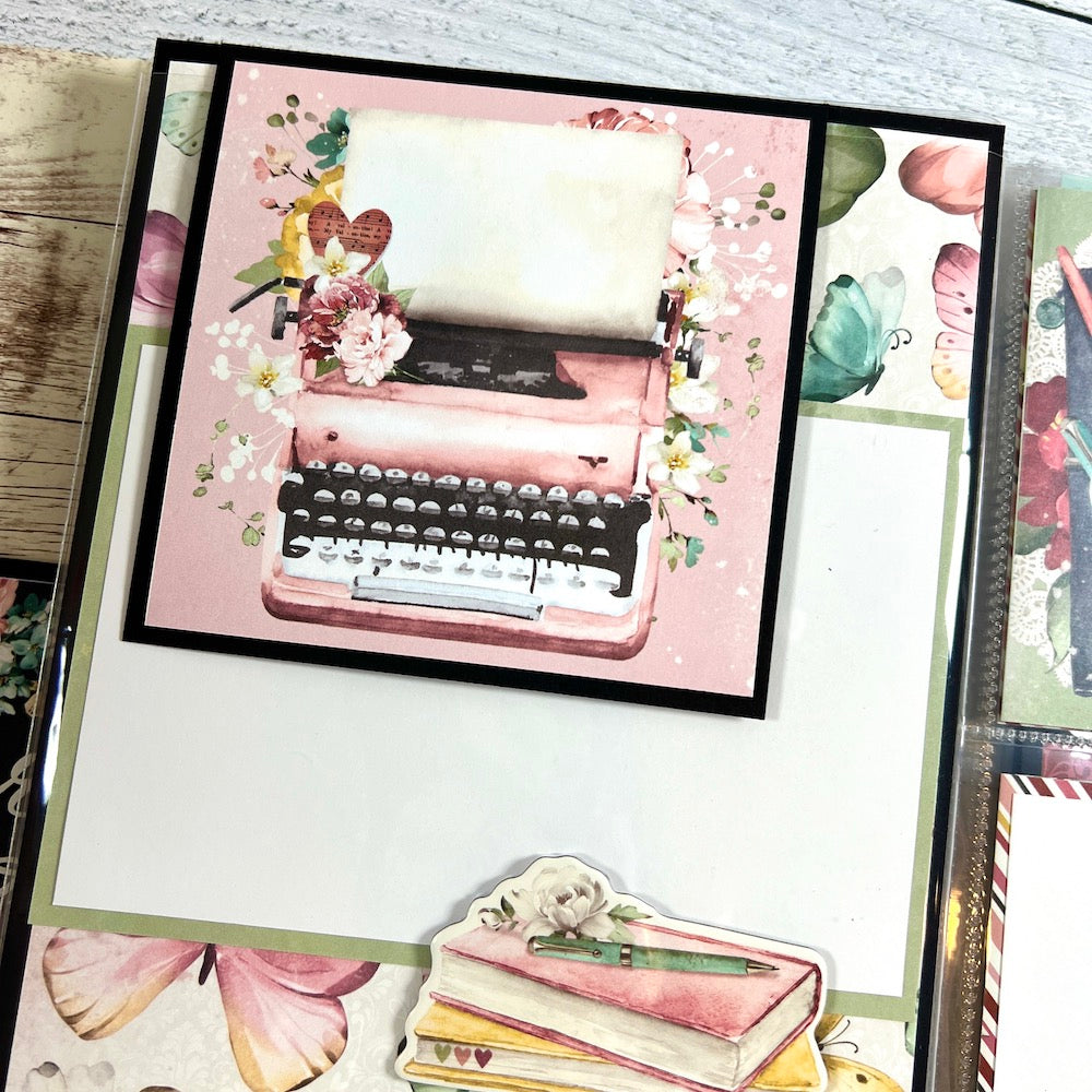It Was Always You scrapbook album page with a pink typewriter, butterflies, and pretty flowers