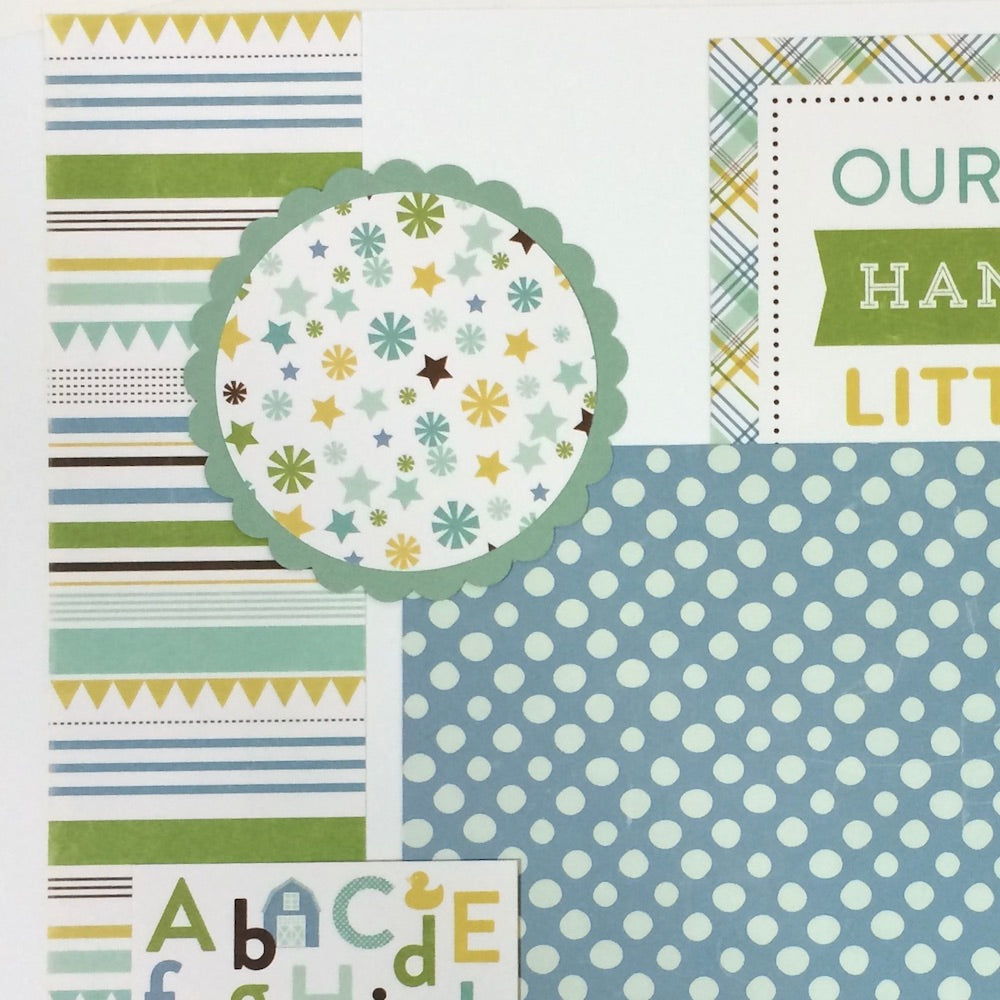 12x12 Sweet Baby Boy Scrapbook Page Layout with a scalloped circle photo mat, stripes, the alphabet, stars, and colorful polka dots
