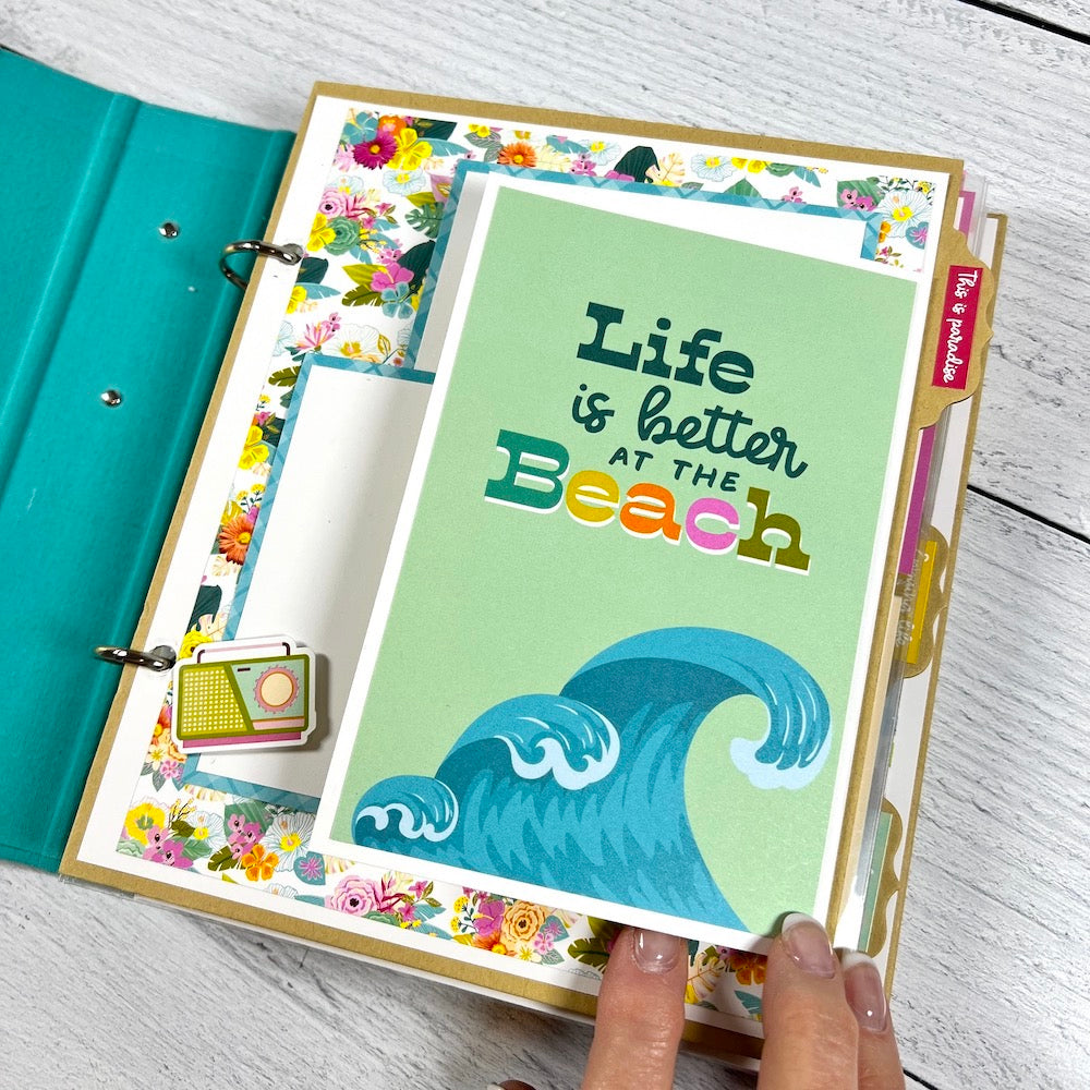 Beach Vibes Scrapbook Album page with tropical flowers, waves, a radio, and a folding card