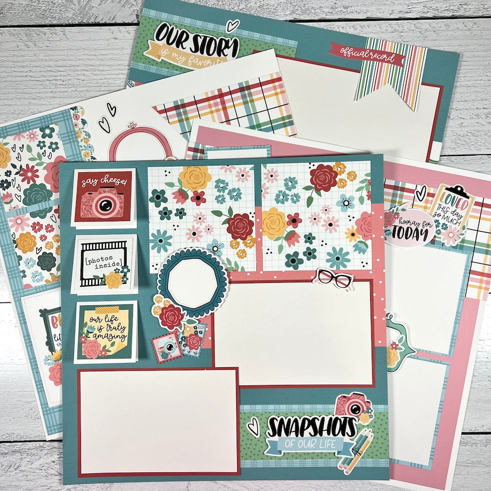 12x12 scrapbook page layouts with pretty colors, flowers, and cameras